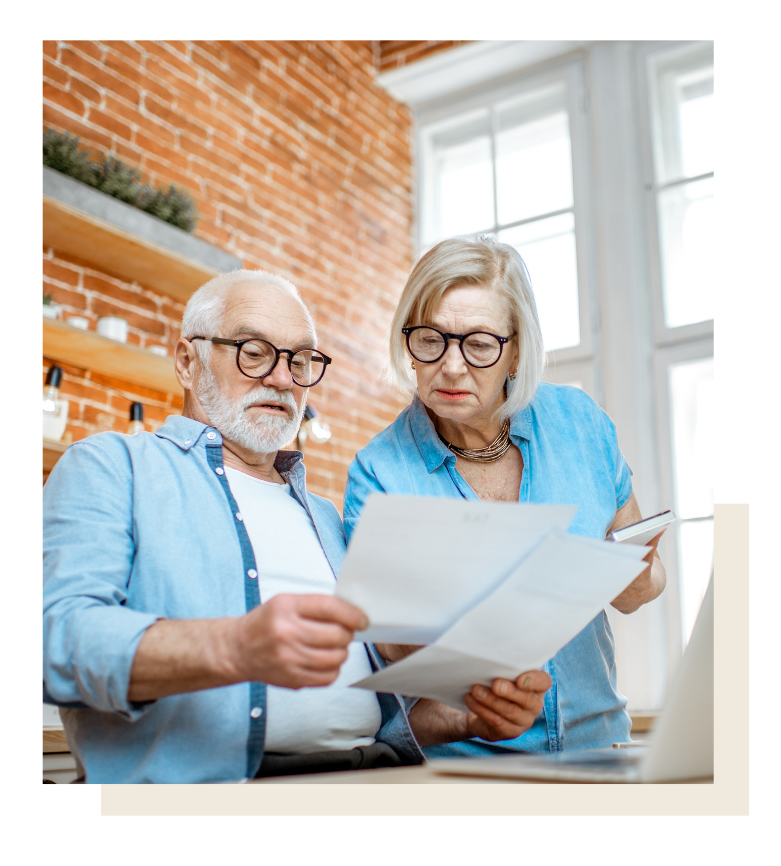 older couple reviewing paperwork related to will in Texas estate planning