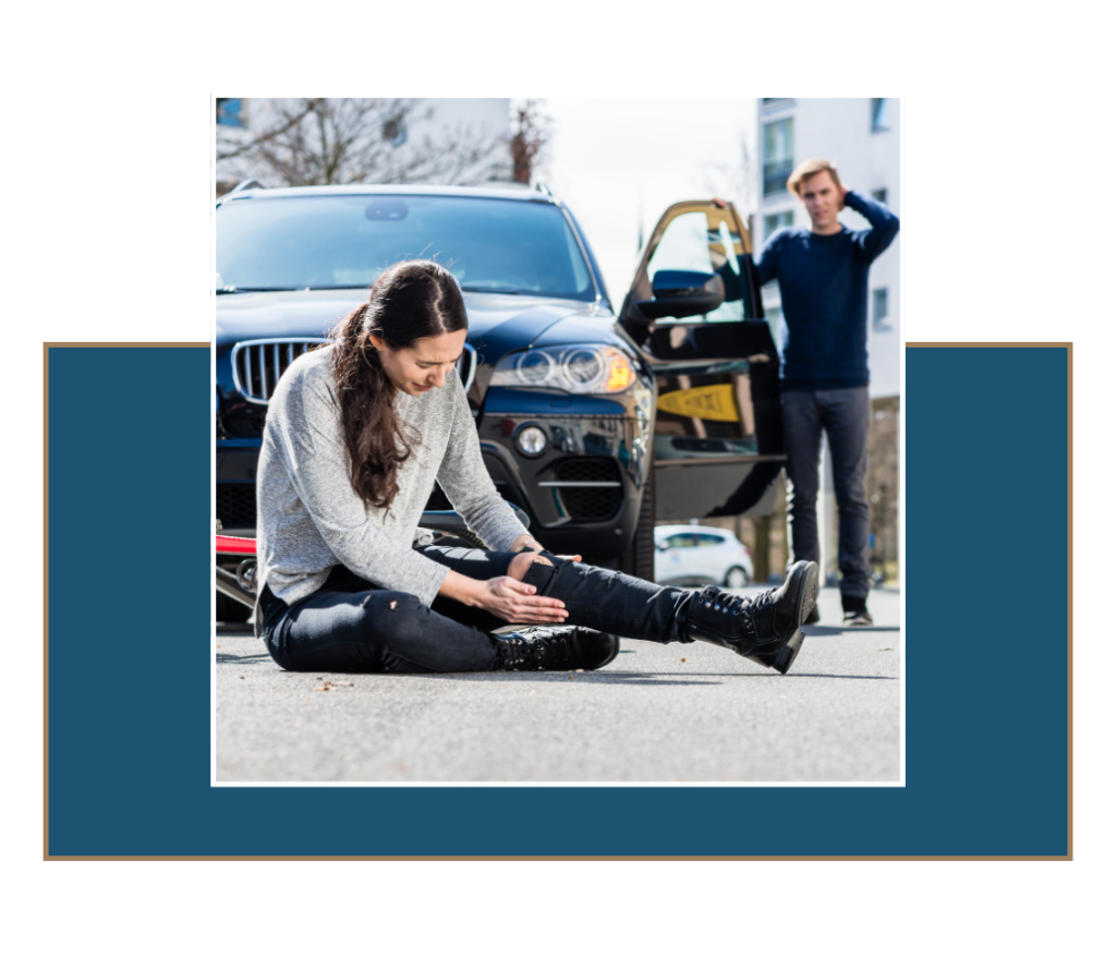 img1 » Ybarra Law Firm Injured woman sitting on road after car accident