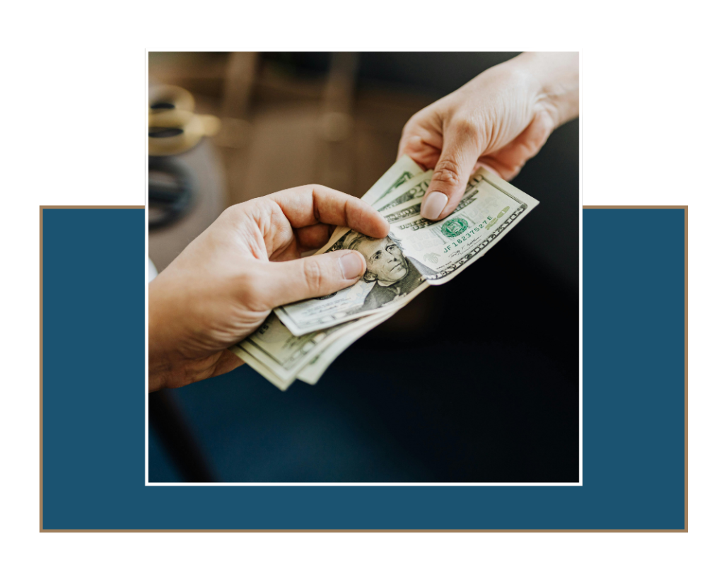 img13 » Ybarra Law Firm Money being handed to another person