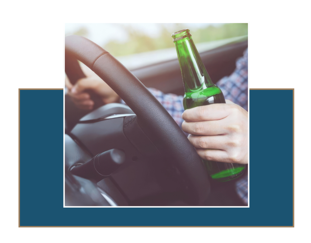 img9 » Ybarra Law Firm Driver holding alcohol bottle behind the wheel